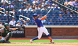 Mark Vientos #27 of the New York Mets is connecting for a two-run homer during the third i...