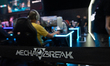 Gaming enthusiasts play at the Mecha Break booth during the opening day of Gamescom in Col...