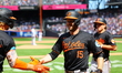 Baltimore Orioles' Austin Slater #15 is congratulated after hitting a two-run homer during...