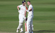 Durham's Alex Lees celebrates with Ashton Turner after scoring a century during the Vitali...