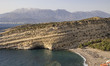 The ancient artificial caves in the cliff of the Matala bay, just above the famous sandy b...
