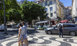 A Tuk Tuk transports tourists in Lisbon, Portugal, on August 24, 2024. Tourism in Portugal...