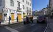 A Tuk Tuk transports tourists in Lisbon, Portugal, on August 24, 2024. Tourism in Portugal...