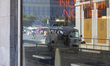 A Tuk Tuk is reflected on a glass while looking for tourists in Lisbon, Portugal, on Augus...