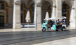 A Tuk Tuk transports tourists in Lisbon, Portugal, on August 24, 2024. Tourism in Portugal...