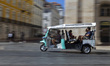 A Tuk Tuk transports tourists in Lisbon, Portugal, on August 24, 2024. Tourism in Portugal...