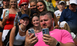 CHORZOW, POLAND - AUGUST 25:Joe Kovacs of the USA takes selfies with fans after competing...
