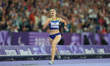 Nataliia Kobzar of Ukraine celebrates winning gold in Women's 400m - T37 Final during the...