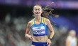Nataliia Kobzar of Ukraine celebrates winning gold in Women's 400m - T37 Final during the...