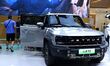 People look at various vehicles at the 23rd Autumn International Auto Show in Qingdao, Chi...