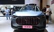 People look at various vehicles at the 23rd Autumn International Auto Show in Qingdao, Chi...