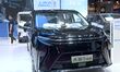 People look at various vehicles at the 23rd Autumn International Auto Show in Qingdao, Chi...