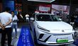 People look at various vehicles at the 23rd Autumn International Auto Show in Qingdao, Chi...