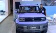 People look at various vehicles at the 23rd Autumn International Auto Show in Qingdao, Chi...