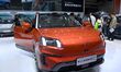 People look at various vehicles at the 23rd Autumn International Auto Show in Qingdao, Chi...