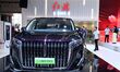 People look at various vehicles at the 23rd Autumn International Auto Show in Qingdao, Chi...