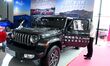 People look at various vehicles at the 23rd Autumn International Auto Show in Qingdao, Chi...