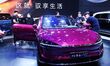 People look at various vehicles at the 23rd Autumn International Auto Show in Qingdao, Chi...