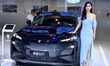 A model displays a new car at the 23rd Autumn International Auto Show in Qingdao, China, o...