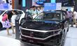 People look at various vehicles at the 23rd Autumn International Auto Show in Qingdao, Chi...