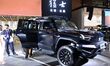 People look at various vehicles at the 23rd Autumn International Auto Show in Qingdao, Chi...