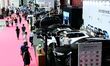 People look at various vehicles at the 23rd Autumn International Auto Show in Qingdao, Chi...