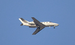A 9H-HMJ Harmony Jets Malta Dassault Falcon 10 flies over the match venue during the UEFA...
