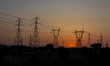 Summer sunset in Greece with electrical pylons near Thessaloniki city. High voltage electr...