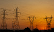 Summer sunset in Greece with electrical pylons near Thessaloniki city. High voltage electr...