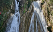 Indian tourists enjoy the cool water at Kempty Falls near the town of Mussoorie, Uttarakha...