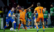 Bosnia and Herzegovina defender Nihad Mujakic and Netherlands defender Denzel Dumfries dur...