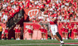 Wisconsin Badgers quarterback Tyler Van Dyke #10 attempts a pass against the South Dakota...