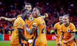 Netherlands forward Brian Brobbey and Netherlands defender Denzel Dumfries celebrate the g...