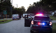 Police cars are near Bauer Pocket Park in Houston, Texas, on September 12, 2024, following...