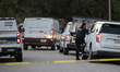 A crime scene unit and various police officials surround Bauer Pocket Park in City, Countr...