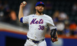 New York Mets starting pitcher Tylor Megill #38 throws during the first inning of the base...