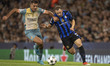 Carlos Augusto #30 of Inter Milan tackles Rodri #16 of Manchester City F.C. during the UEF...