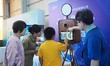 A child takes an AI photo during the 2024 National Science Popularization Day in Beijing,...