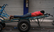 A man sleeps on the cart in Colombo, Sri Lanka, on September 22, 2024. A curfew is imposed...