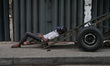 A man sleeps on the cart in Colombo, Sri Lanka, on September 22, 2024. A curfew is imposed...