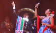 Valeria Cuevas and Aida Cuevas with the Mariachi Real de la Montana perform during the Mar...