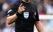 Referee Robert Jones gestures during the Premier League match between Brighton and Hove Al...