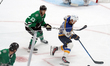 Samuel Johannesson #49 of the St. Louis Blues skates with control of the puck while defend...