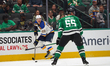 Mackenzie MacEachern #28 of the St. Louis Blues skates with control of the puck while defe...