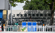 A pedestrian walks past the Nanjing factory of SAIC Volkswagen in Nanjing, China, on Septe...