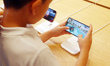 Customers experience Apple's new flagship mobile phone, the iPhone 16, at the largest Appl...