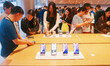Customers experience Apple's new flagship mobile phone, the iPhone 16, at the largest Appl...