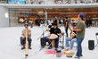 Customers experience Apple's new flagship mobile phone, the iPhone 16, at the largest Appl...