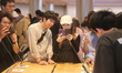 Customers experience Apple's new flagship mobile phone, the iPhone 16, at the largest Appl...