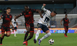 Kevin Balanta #35 of Xolos de Tijuana and Rogelio Funes Mori #29 of Pumas de la UNAM fight...